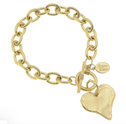 Susan Shaw Gold chain bracelet with a heart charm on a white background