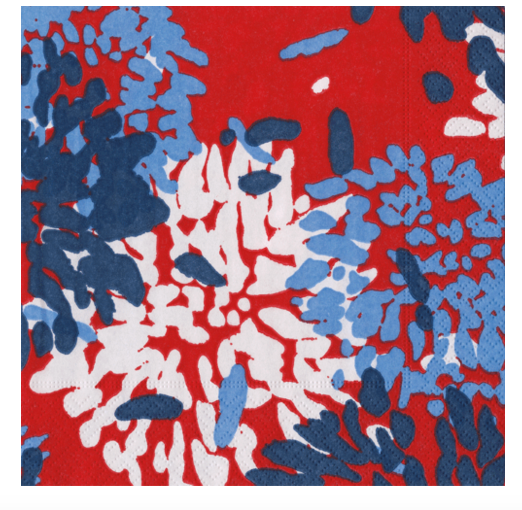 Abstract Caspari luncheon napkin chrysthemum pattern with blue, white, and red colors on a red background