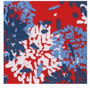 Abstract Caspari luncheon napkin chrysthemum pattern with blue, white, and red colors on a red background