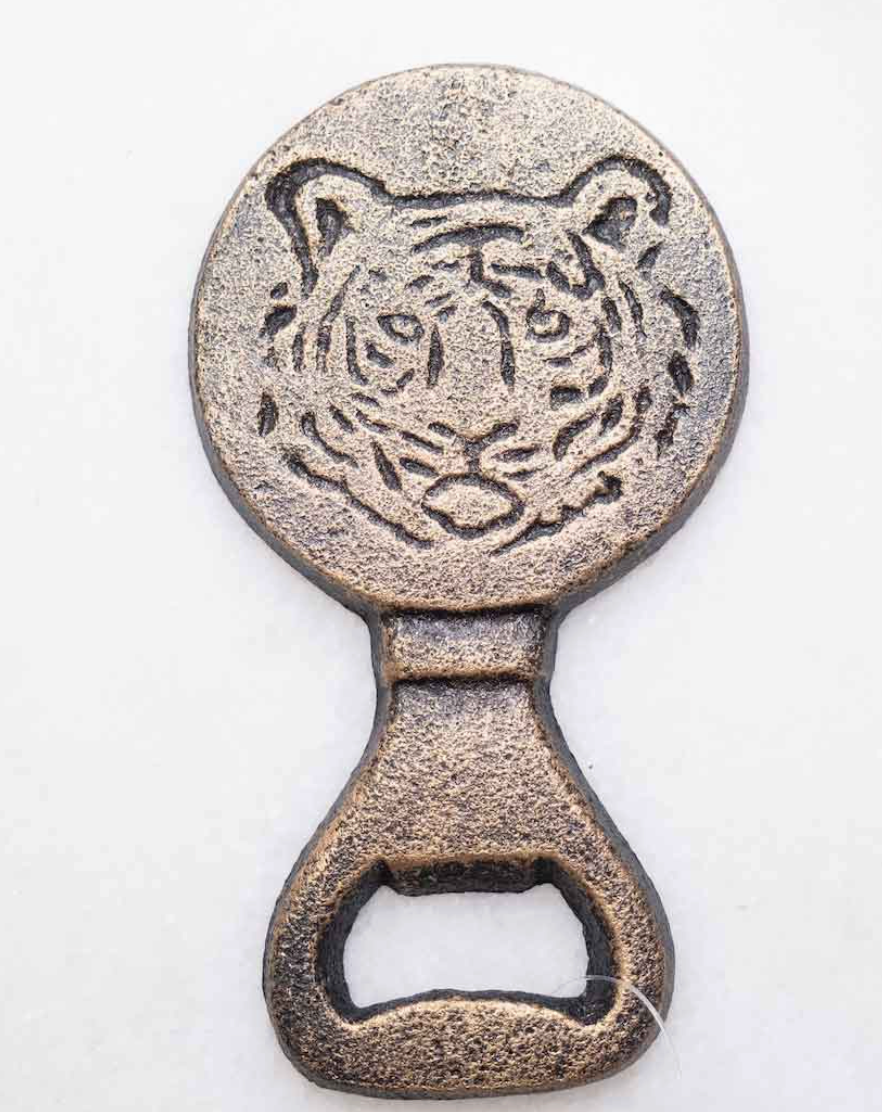 The Royal Standard brand Bronze Gameday bottle opener with tiger design on a white background