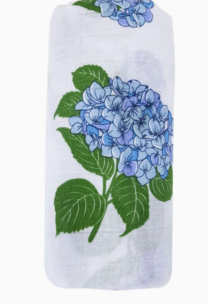 Little Hometown hydrangea swaddle blanket sowing close up of the blue with green leaf hydrangea design on white background