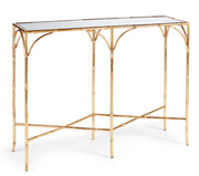 Napa Home and Garden Daphne Console Table that is gold bamboo frame with mirrored top on a white background.