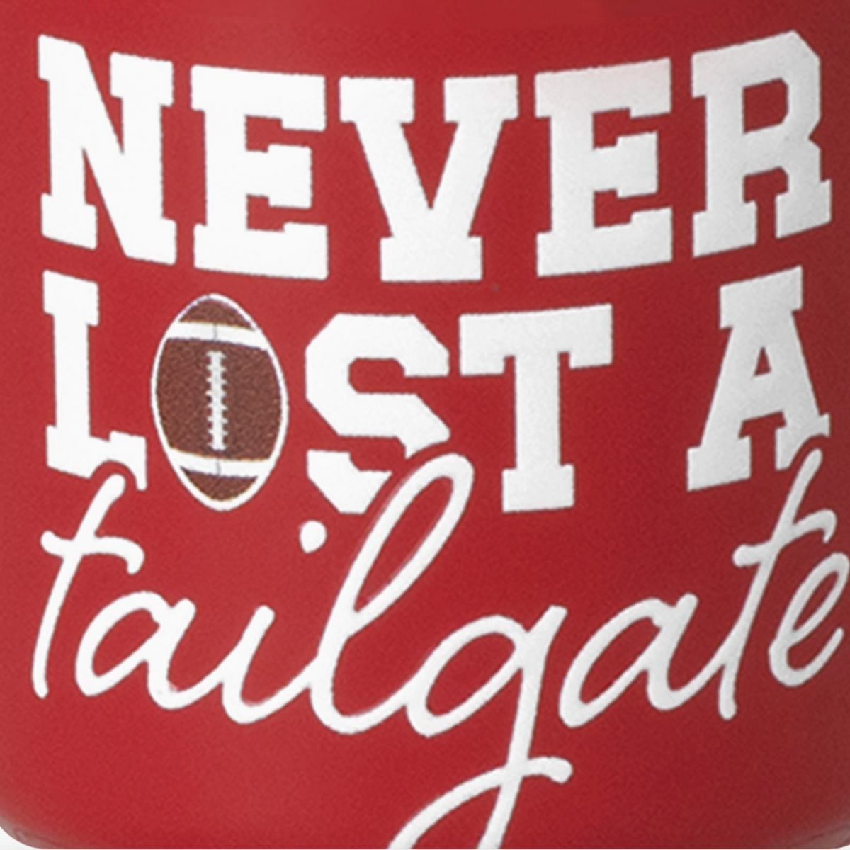 A close-up of a red cylindrical product, likely a can cooler or mug, featuring the phrase 'NEVER LOST A tailgate' in bold white lettering, with a brown football graphic replacing the letter 'O'.