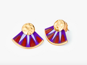 A pair of gold-tone fan-shaped stud earrings with purple, orange and white feathers shown on a plain white background.