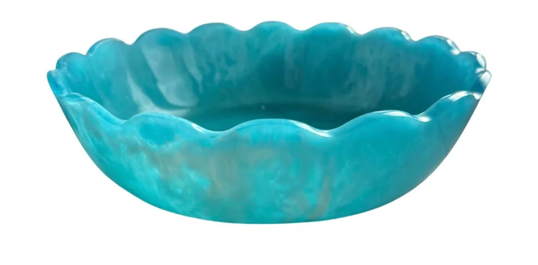 Turquoise marbled resin bowl with scalloped edge on white background. Laura Park Brand