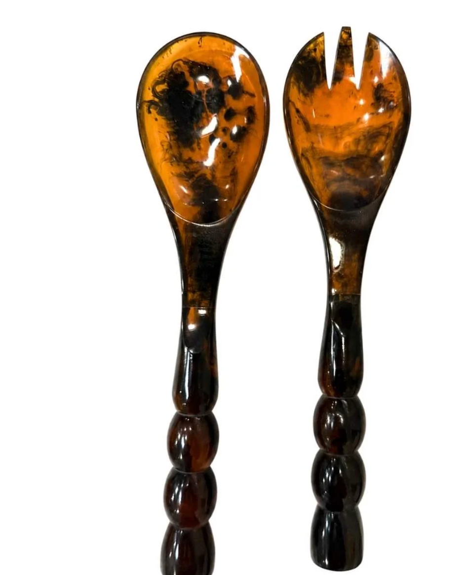 Laura Park tortoise shell resin salad servers with beaded handles on a white background