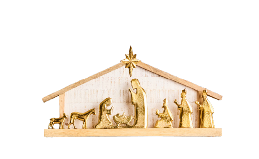 A nativity scene display with gold tone figurines and a light wood stable on a white background.
