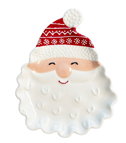 A ceramic Santa Claus face plate or tray with a red patterned hat, peach-toned cheeks and nose, and a white textured beard on a plain white background.