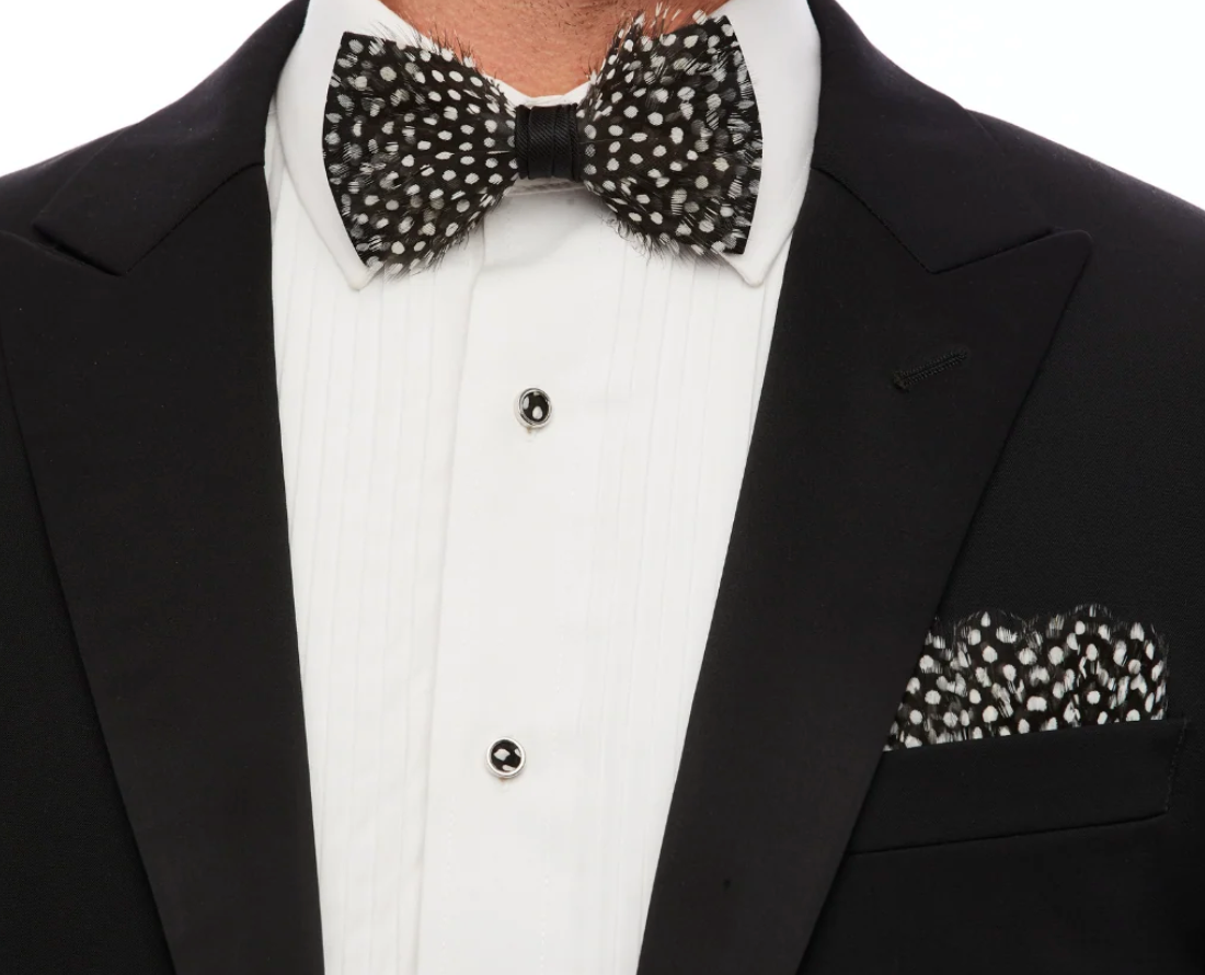 Brackish brand black and white feather  pocket square and bow tie on white shirt with black jacket