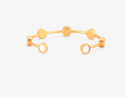 Gold cuff Brackish bracelet with round gold insets of white goose feathers