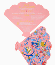 Pink fan-shaped Mahjong shufflers showing bird-and-floral artwork and printed Charleston game reminders on the reverse.