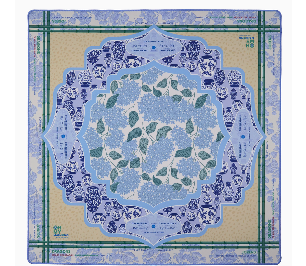Oh My Mahjong Luna mat with blue hydrangeas, a blue-and-white ginger jar border, green bamboo lines, and printed play reminders.