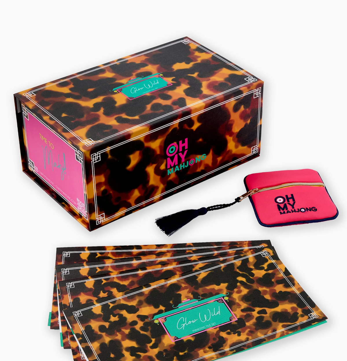 Oh My Mahjong Glow Wild tortoiseshell-pattern box with a pink zippered pouch and matching instructional cards.