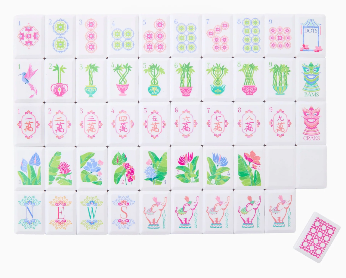 Oh My Mahjong Poppy Debutante tiles with colorful dots, bamboo, tropical flowers, elephant Jokers, and a pink lattice-patterned back.