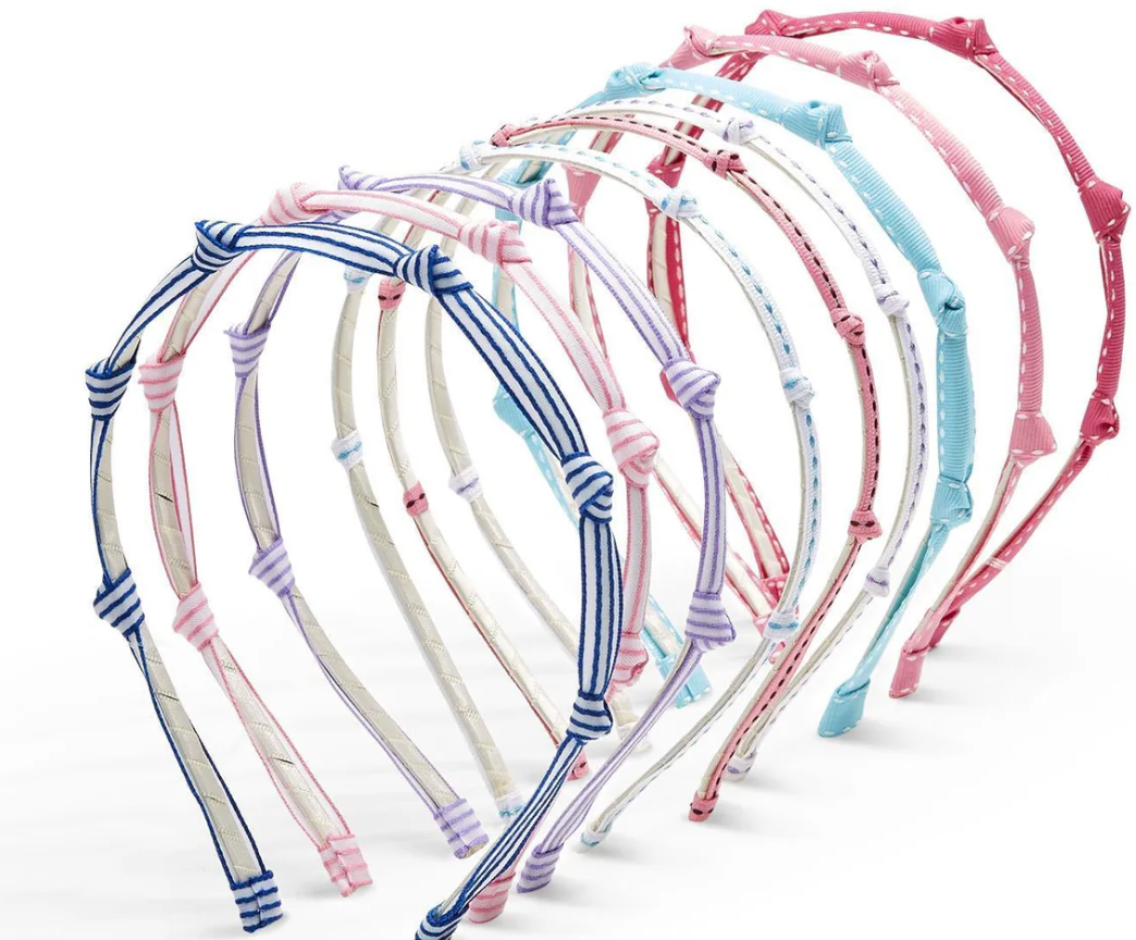 Set of colorful kids ribbon, knotted headbands on a white background