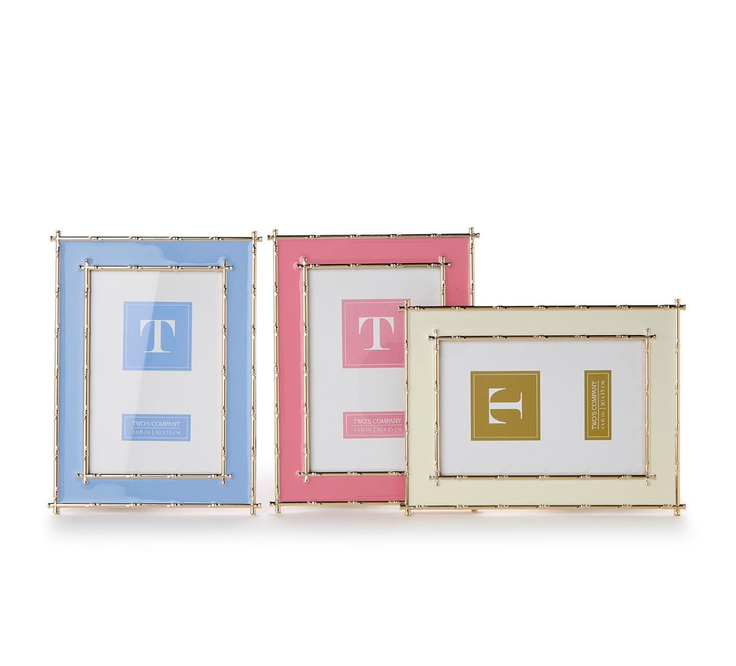 Three decorative picture frames with different colors and letter designs on a white background
