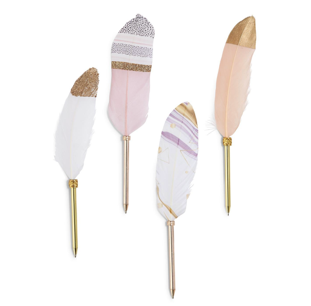 Decorative feather pink, gold and white pens with gold stylus on a white background