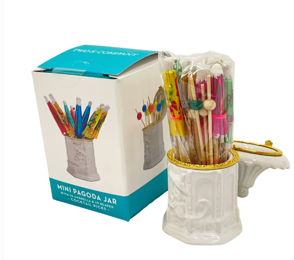 White pagoda jar with colorful umbrella and cocktail picks and packaging on a white background