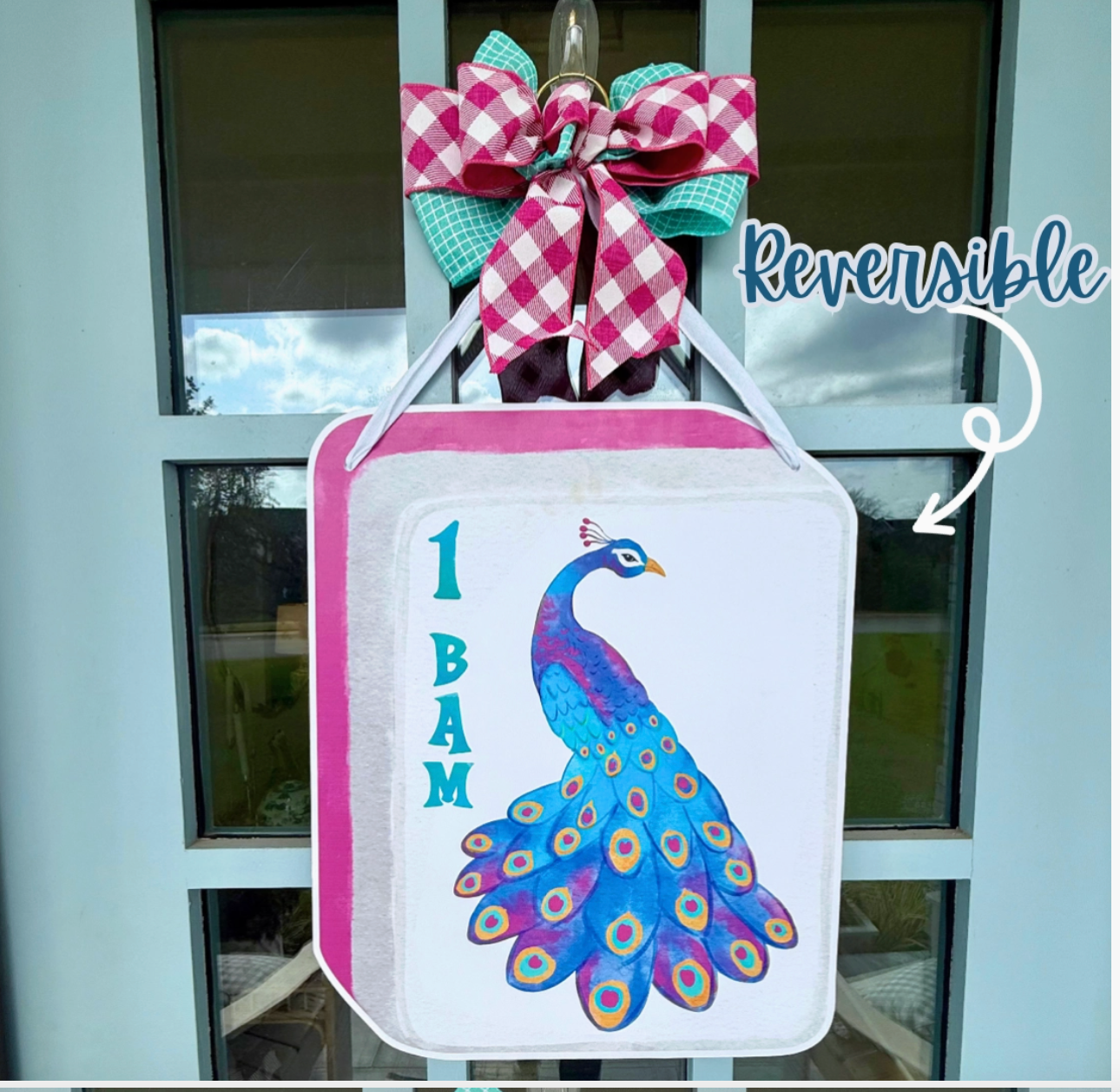 1 bam peacock mahjong Tile door hanger with bow and copy that says "reversible" on blue door 