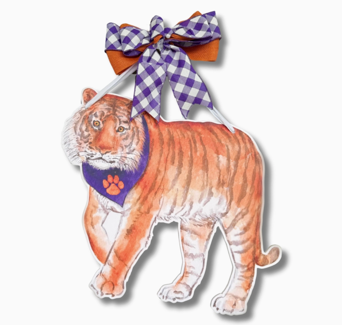 orange tger with purple scarf and purple bow hanging on white background