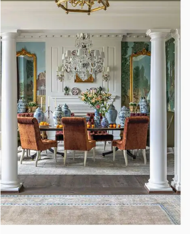 Dining room with brown chairs, a table, and decorative elements.