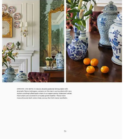 Decorative setting with blue and white ceramic vases, a mirror, and fruits on a table.