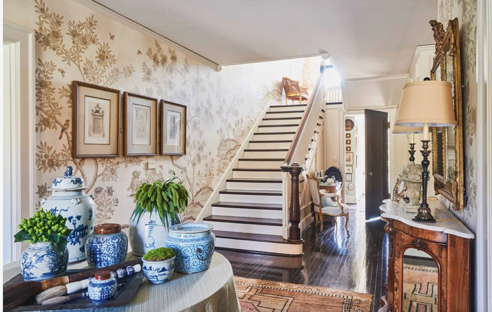 Staircase in a home with decorative elements and furniture.