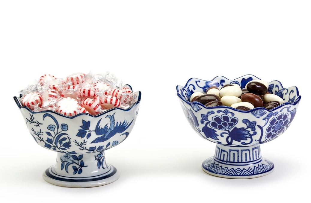 Two's Company  decorative bowls with blue floral patterns filled with candies on a white background