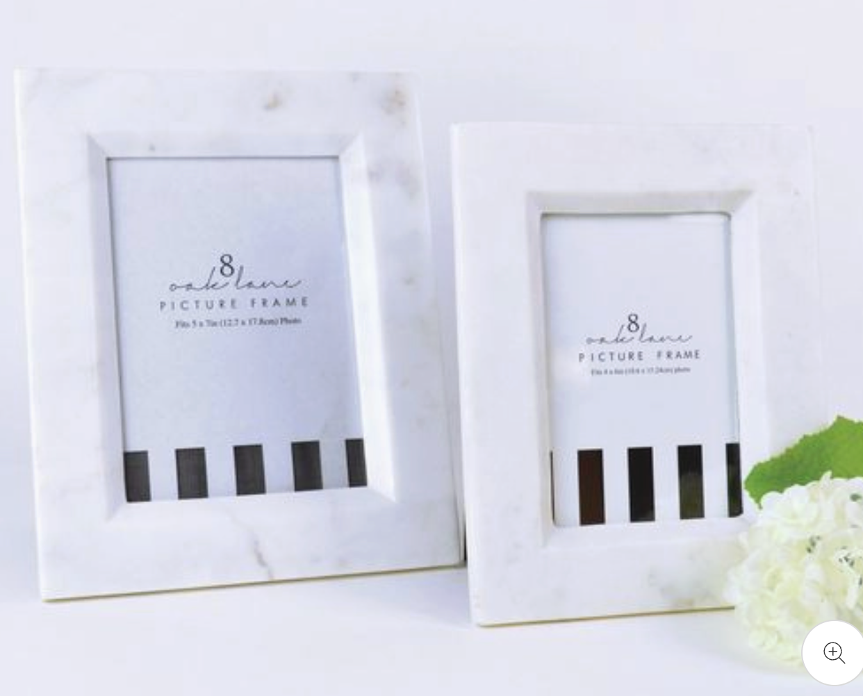 Two white 8 Oak Lane Marble picture frames with insert that has black stripes on a light background