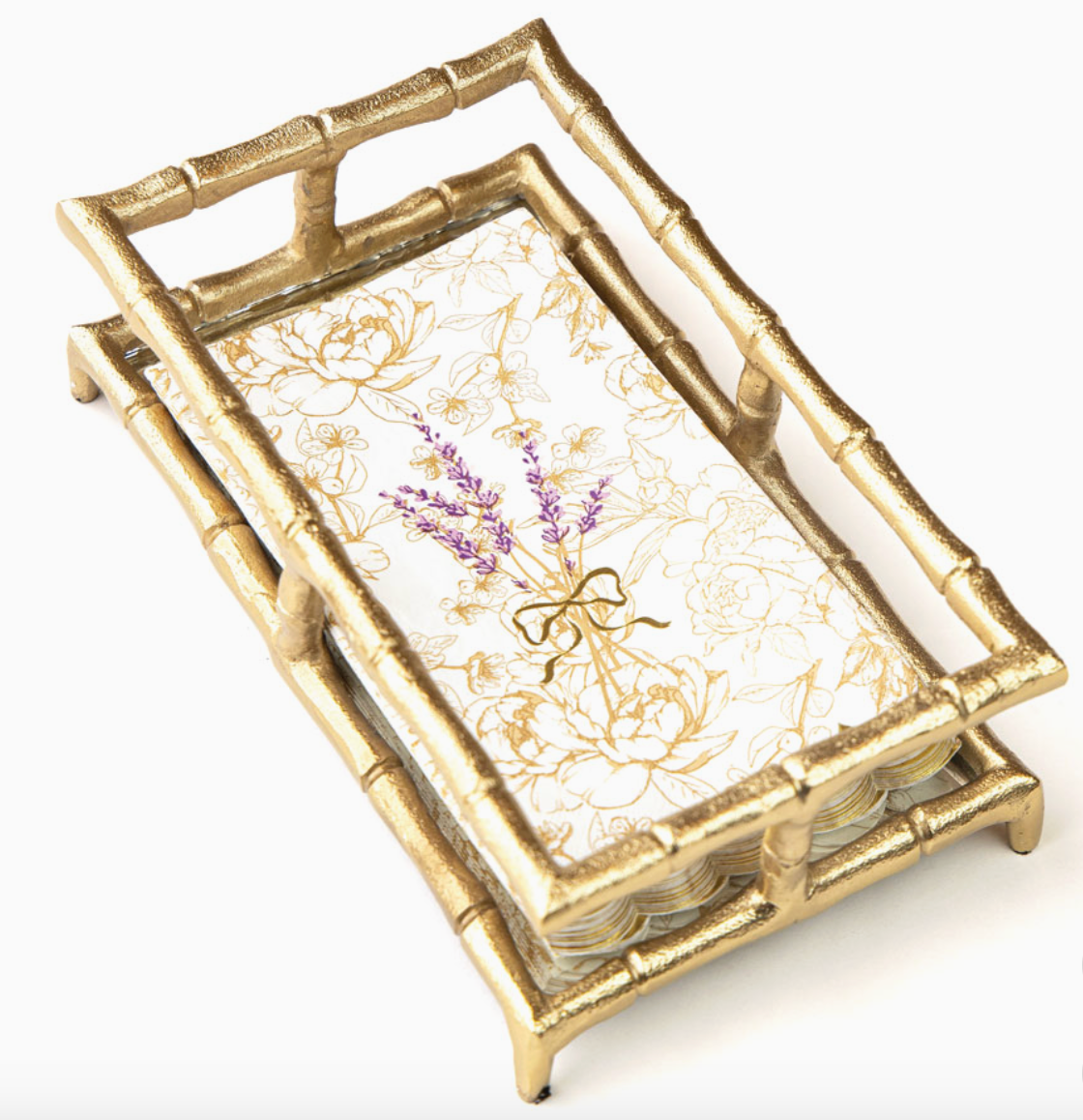 8 Oak Lane Brand Decorative guest size paper napkins with floral design and lavender in a gold bamboo napkin holder on a white background