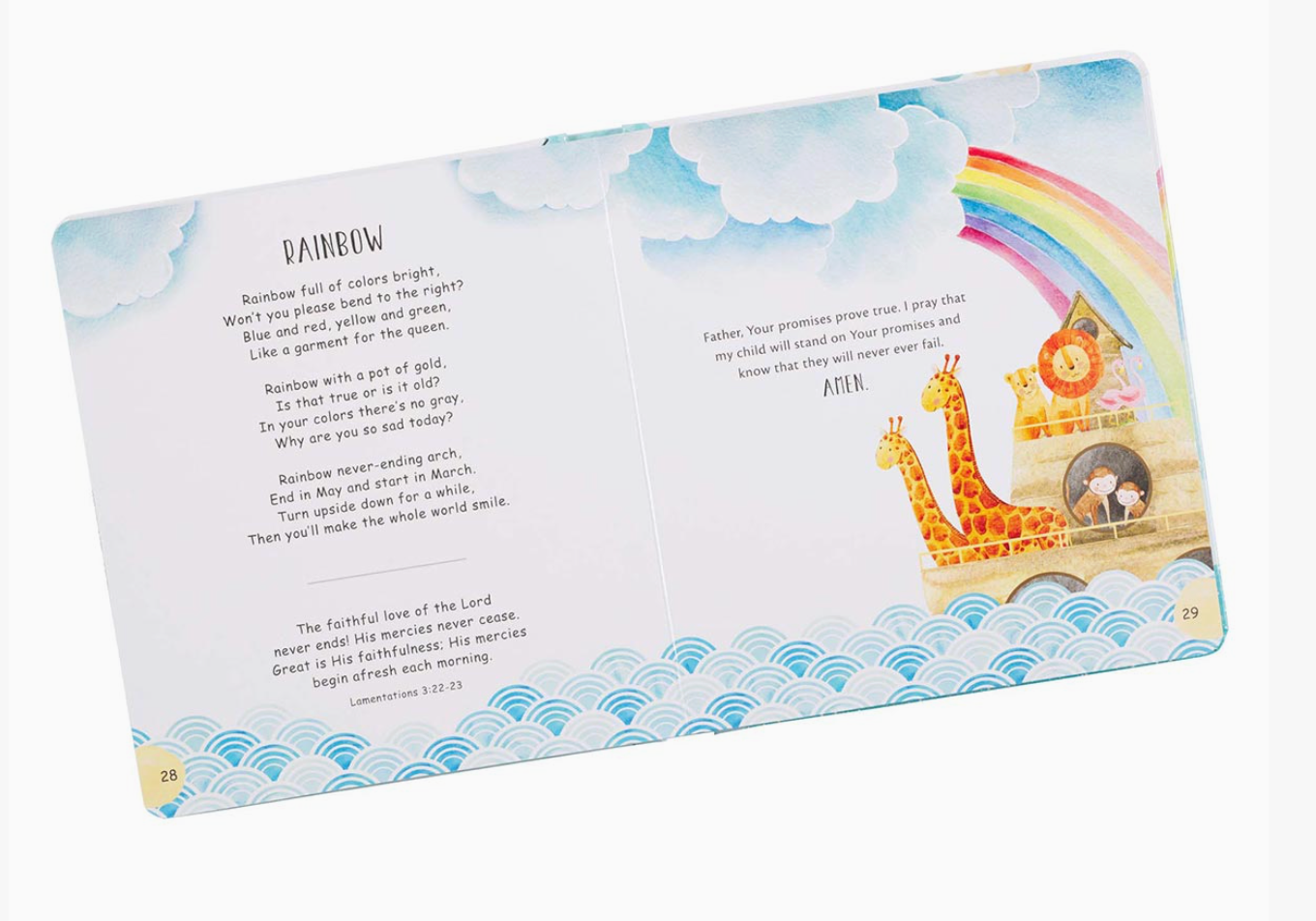 Children's book "My Lulabible for Boys" open to a blue and white with animals and rainbow illustration on a white background. Author is Alette-Johanni Winckler 