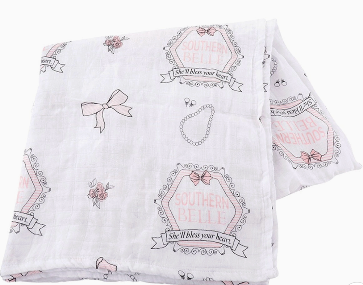 Little Hometown Brand White and pink and gray blanket with bows, pearl necklace and flowers graphic decorative pink text and graphics on a white background