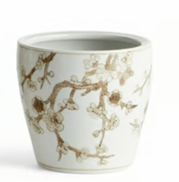 A NAPA HOME AND GARDEN brand white ceramic cachepot decorated with a delicate brown floral branch pattern, shown against a plain white background.