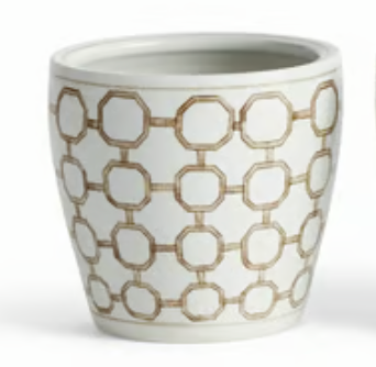 A Napa home and garden brand white ceramic  cachepot with a repeating taupe geometric interlocking hexagon pattern, shown against a plain white background.