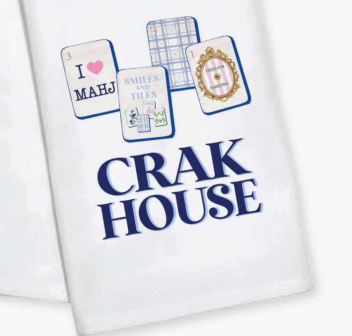 A Toss Designs white kitchen towel featuring a printed design of four mahjong tiles and the text 'CRAK HOUSE' in bold navy blue lettering.