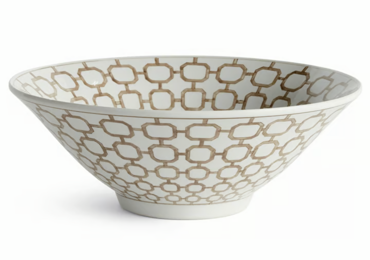 A white ceramic bowl with an elegant soft brown geometric trellis pattern, photographed on a clean white background.
