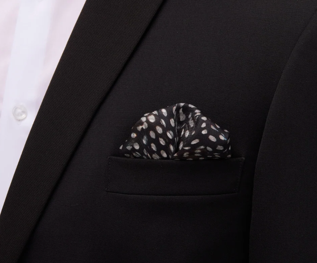 Silk Brackish brand scarf pocket square with guinea feather pattern black, white and blue design on black suit