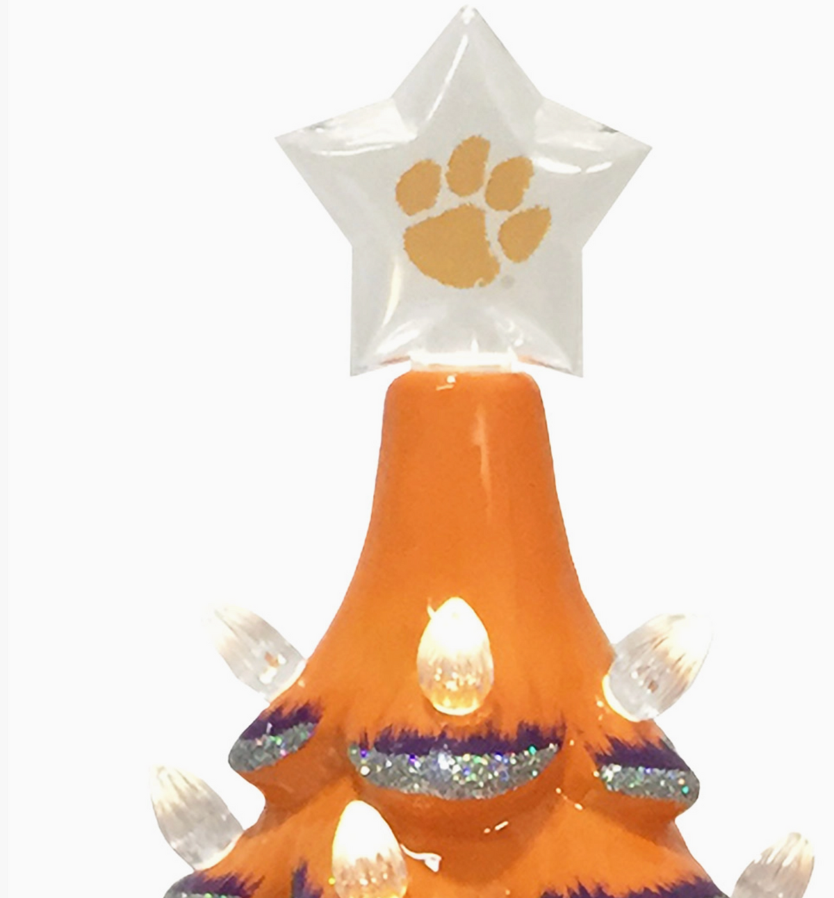 An orange Christmas tree topper with a clear star on top featuring an orange Clemson paw print, decorated with warm white lights and silver glitter accents, shown against a plain white background.