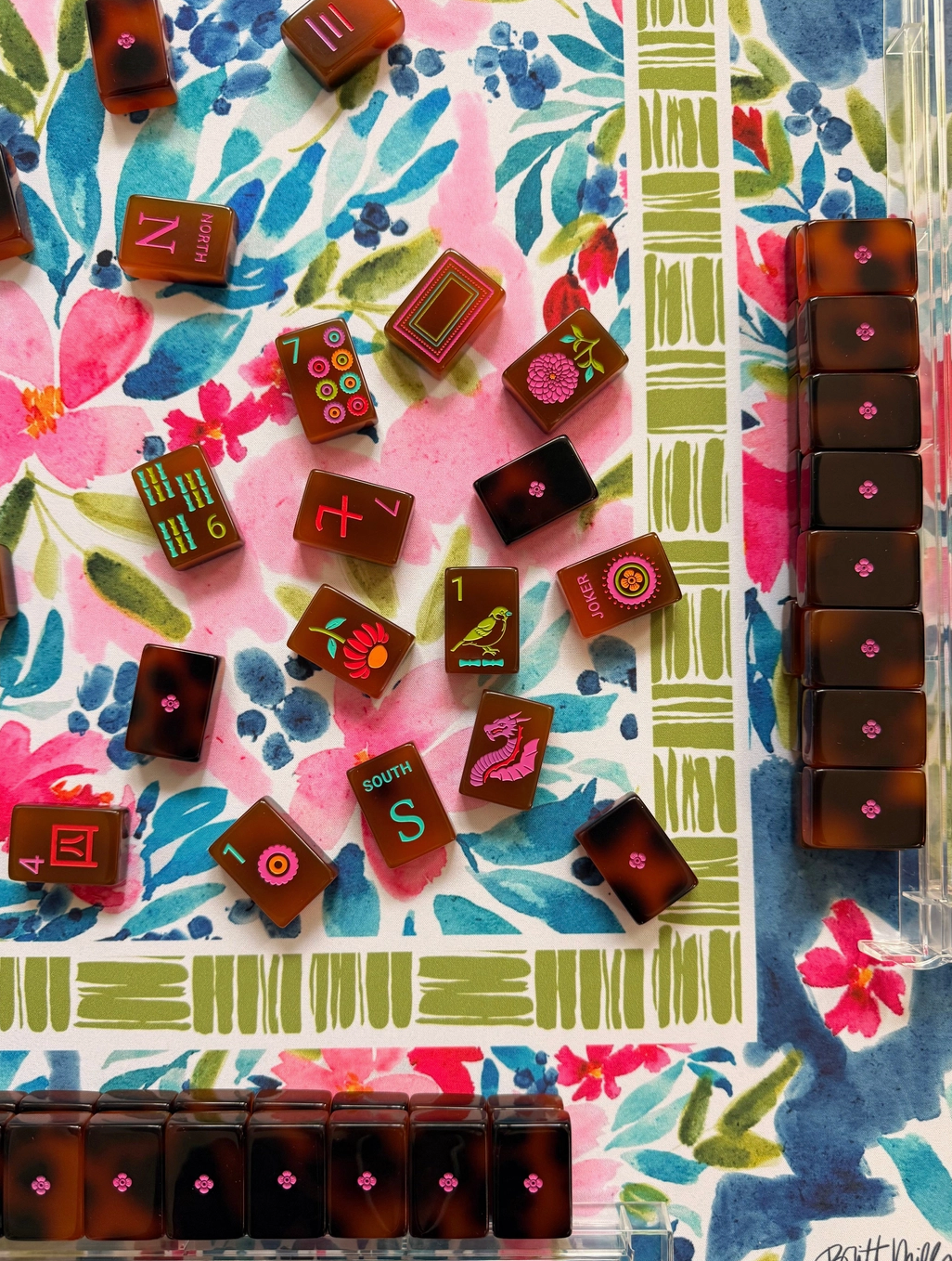 mahjong brown tiles on flowered mat with green border