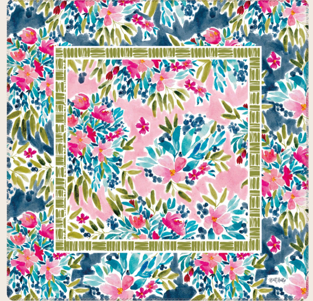 A britt Mills brand mahjong mat with a floral print in pink, blue, green, and white, bordered by a green geometric frame. The sample is centered on a light beige background with text reading 'Atia', 'SHIPS FROM THE USA!', 'Britt Mills', and additional small disclaimer text.