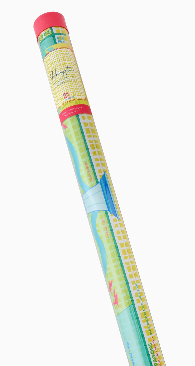 Oh My Mahjong Hampton mat rolled inside a clear storage tube with a coral-red cap and yellow label.
