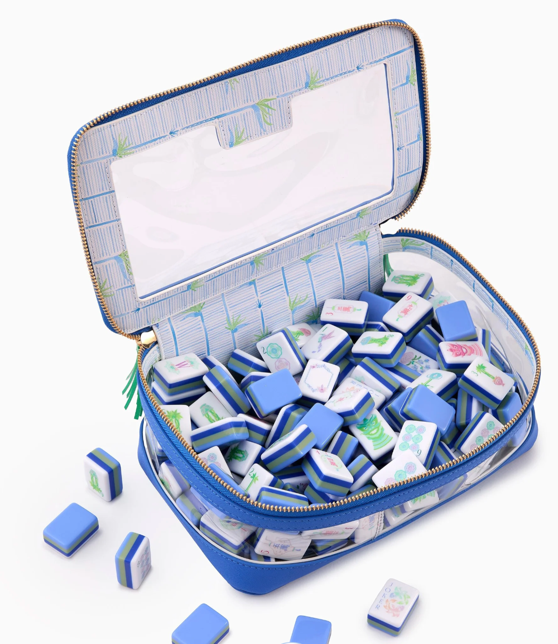 Oh My Mahjong Moonlight tiles inside an open blue-trimmed storage bag with clear sides and patterned lining.