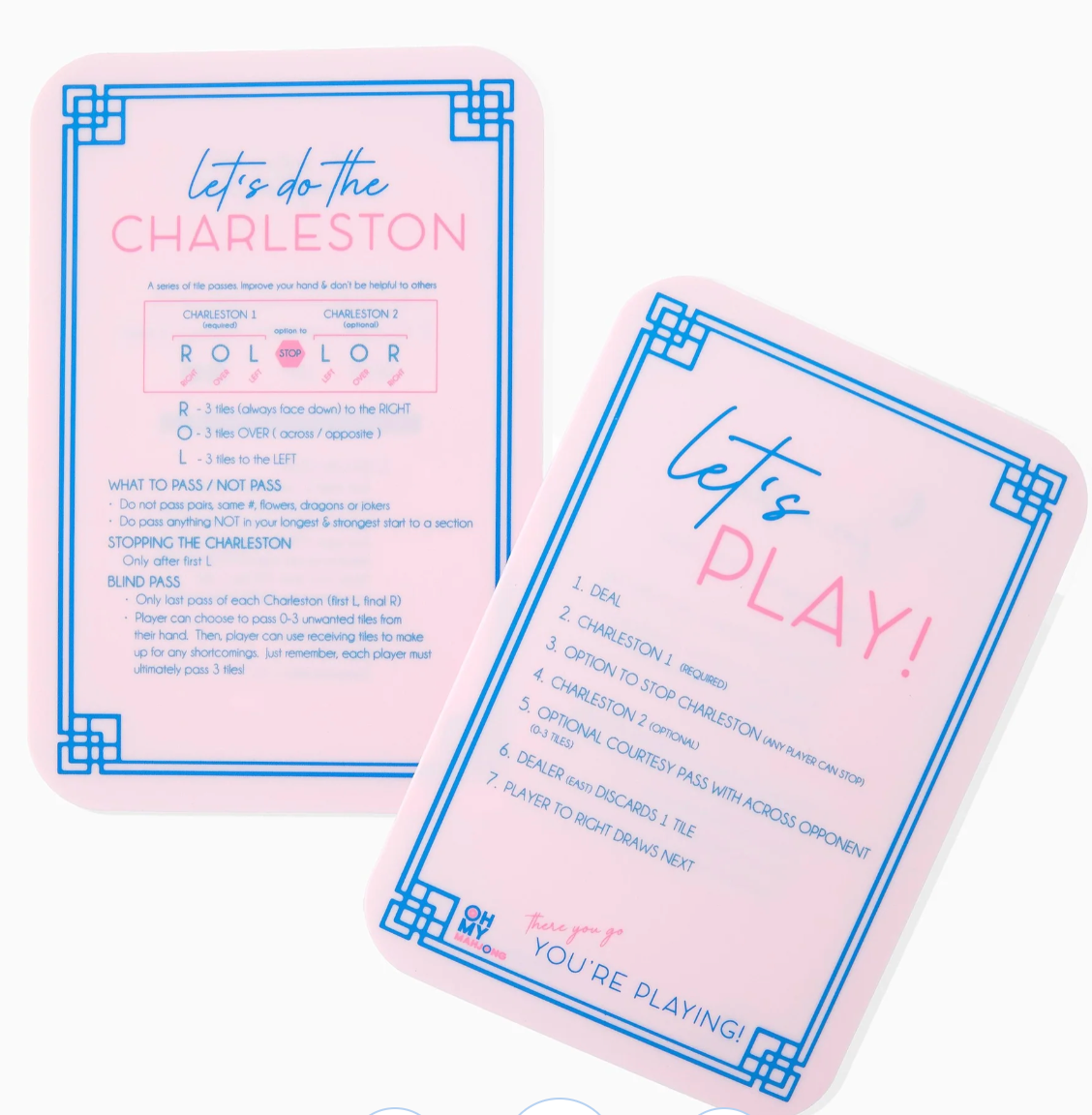 Oh My Mahjong pink reference cards with blue borders, showing Charleston passing reminders and the order of play