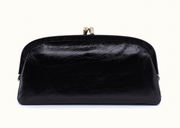 Front of Hobo Alba black frame wallet with a textured finish, curved frame, and metal clasp closure.
