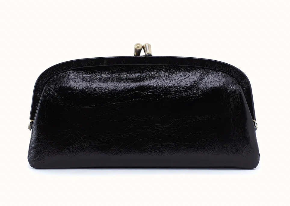 Front of Hobo Alba black frame wallet with a textured finish, curved frame, and metal clasp closure.