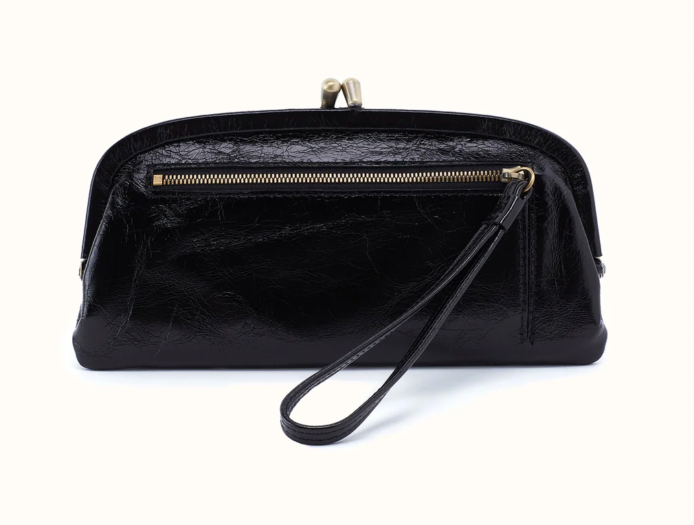 Back of Hobo Alba black frame wallet with a zipper pocket, wristlet pull, and metal clasp closure.