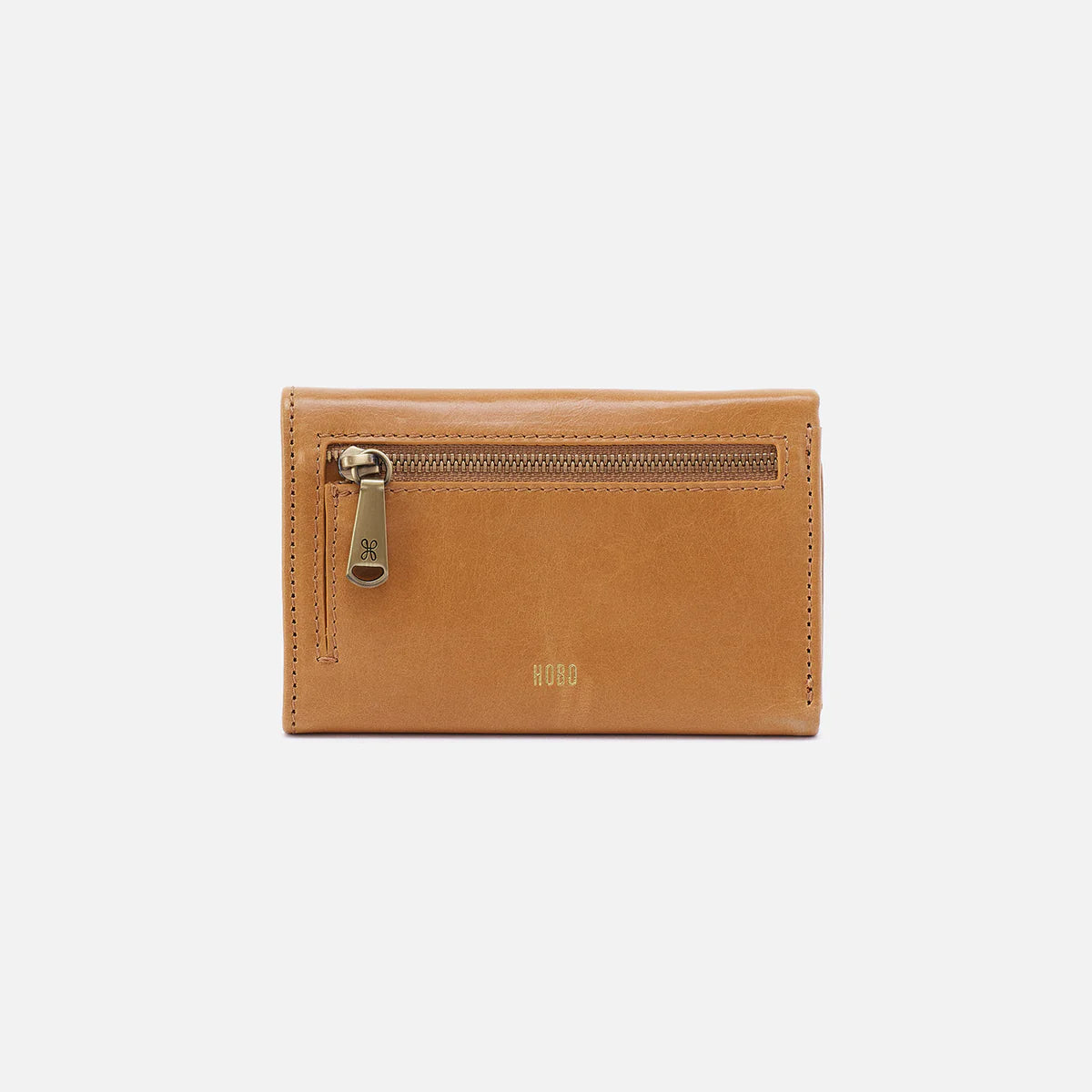 Brown leather wallet with a gold zipper on a light gray background