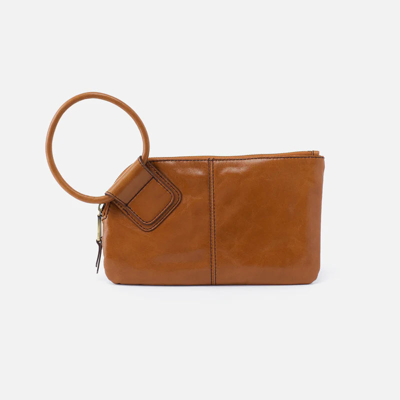 Brown leather clutch bag with a round handle on a white background