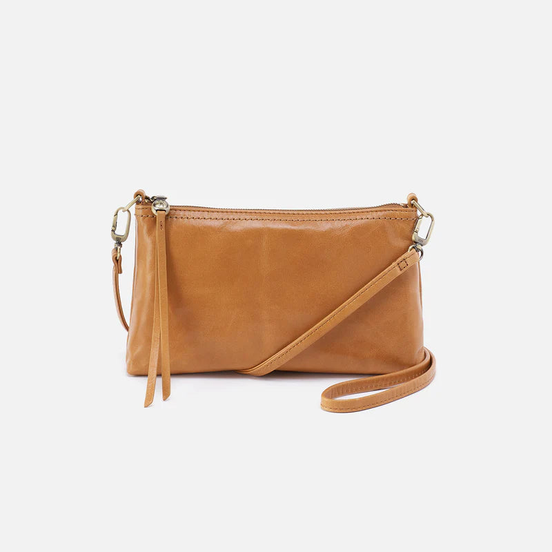 Tan leather crossbody bag on a white background