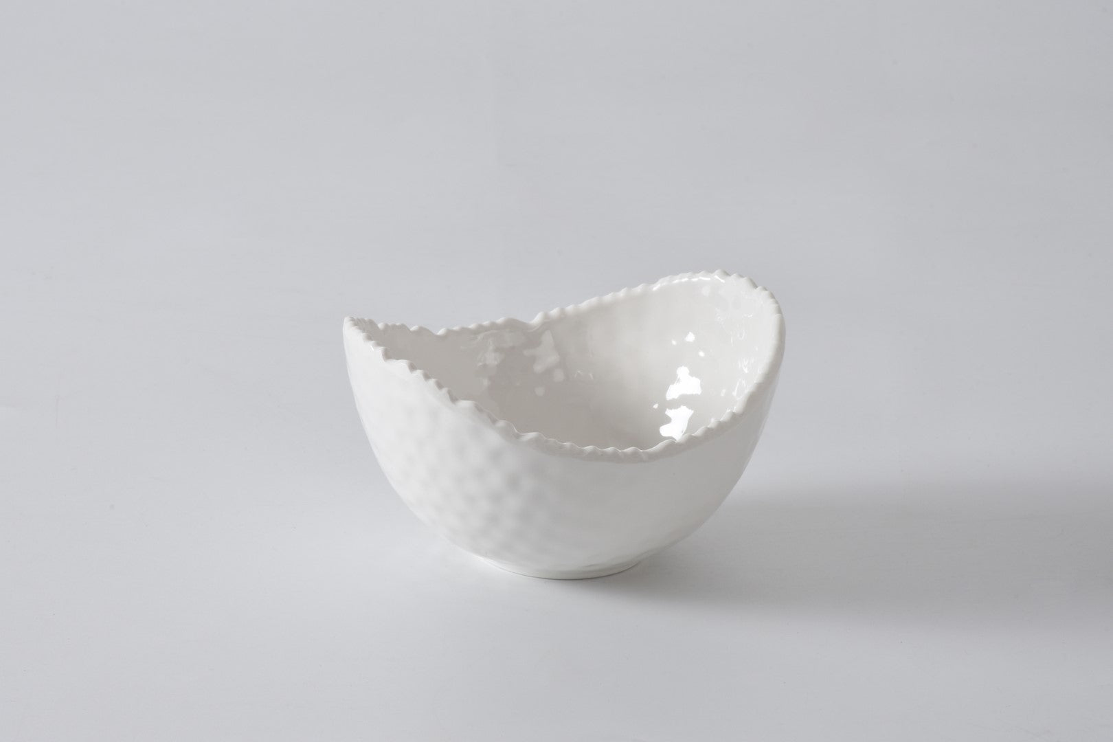 Pampa bay White melamine bowl with textured edge on a light gray background